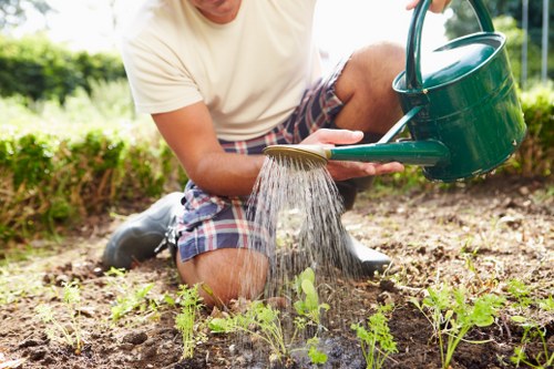 Community gardeners collaborating with accessible gardening tools and signage in Brompton